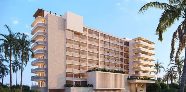 Front elevation of the two beachfront towers at dusk
