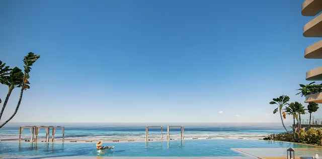Infinity pool set against the shoreline